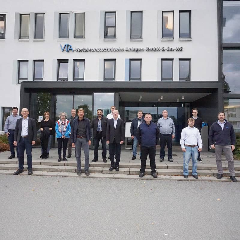 15 employees standing in front of the VTA building