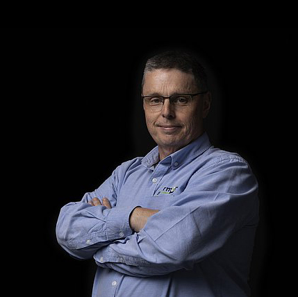 Laurence Fletcher man with arms crossed against black background