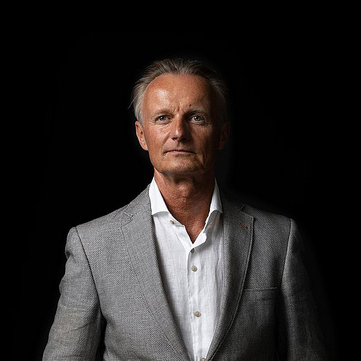 Hugo Grunder man's portrait against black background